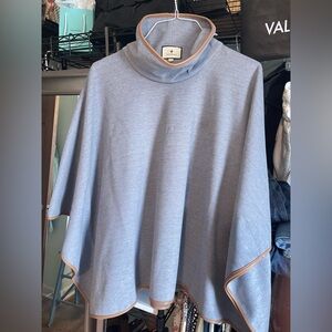 Tuckernuck sleeved poncho. One size fits most. Light blue w/ tan leather trim
